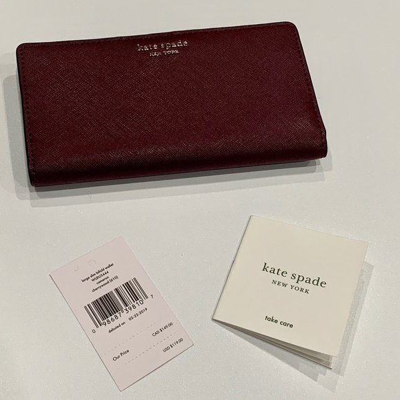 kate spade Handbags - KATE SPADE Large Slim Bifold Wallet Cherry-wood
